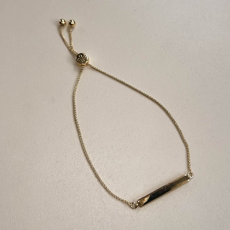 Gold Bar Bolo Bracelet - Nickel & Suede Simple Adjustable Gold Bracelet With Delicate Chain, Minimalist Adjustable Gold Bracelet With Delicate Chain, Minimalist Metal Jewelry With Sliding Knot, Minimalist Everyday Jewelry With Adjustable Band, Everyday Metal Bracelets With Adjustable Length, Everyday Adjustable Metal Bracelets, Classic Adjustable Gold Bracelet With Delicate Chain, Dainty Chain Bracelet With Adjustable Length, Gold Minimalist Chain Bracelet With Adjustable Length