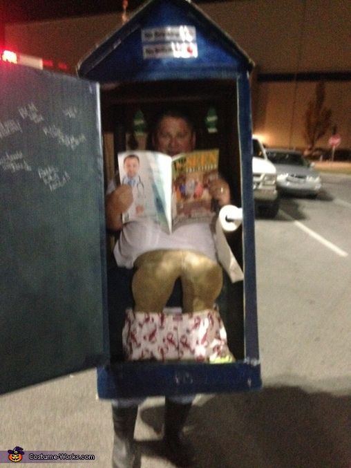 a man is reading a magazine in a mailbox