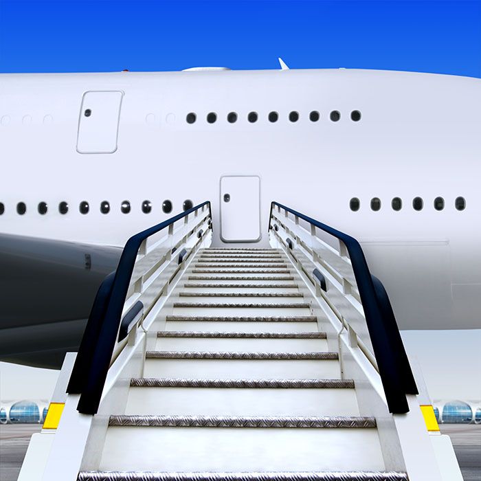 an airplane with stairs leading up to it