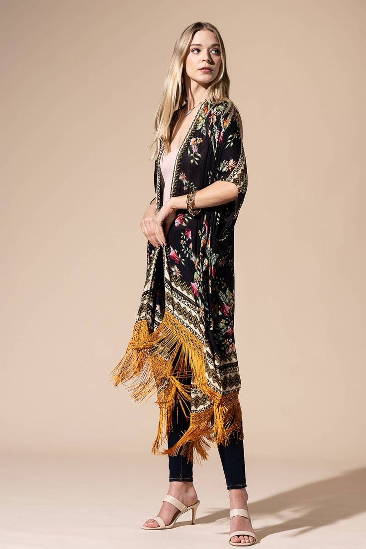 Stunning floral print with ethnic border featuring fine tassel kimono with side slits free size *100% Viscose *APPROX. L 37.50" W 39.5" Fringe L 7.50" 9.49oz *Imported Traditional Spring Kaftan With Back Tassel Tie-up, Traditional Kaftan With Back Tassel Tie-up For Spring, Traditional Printed Kimono For Beach Cover-up, Traditional Spring Kaftan With Tassels, Traditional Kimono With Tassels, Long Tasseled Kimono For Spring, Spring Bohemian Shawl Kimono, Traditional Long Kimono With Tassels, Spring Multicolor Kaftan With Tassels