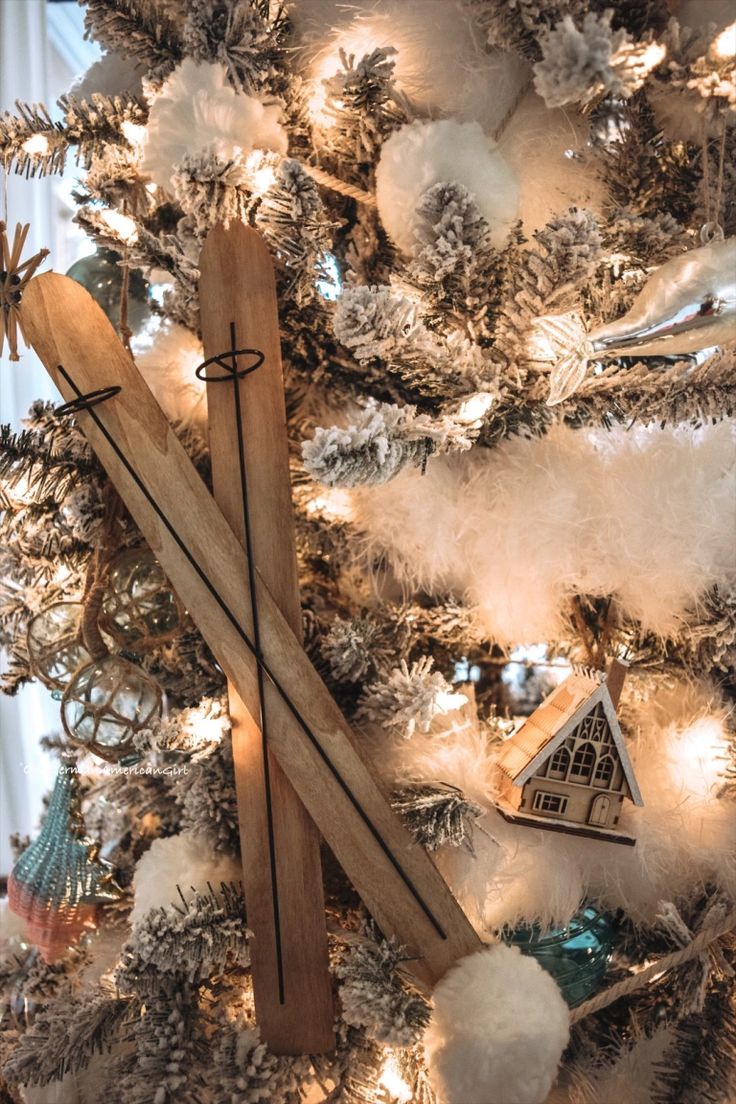 a christmas tree decorated with snow skis and ornaments