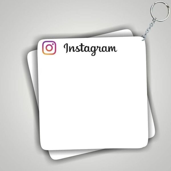 an instagram keychain with the word instagram on it and two sheets of paper