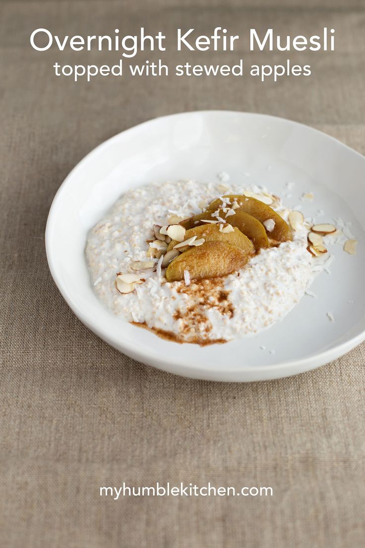 a bowl filled with oatmeal topped with sliced apples