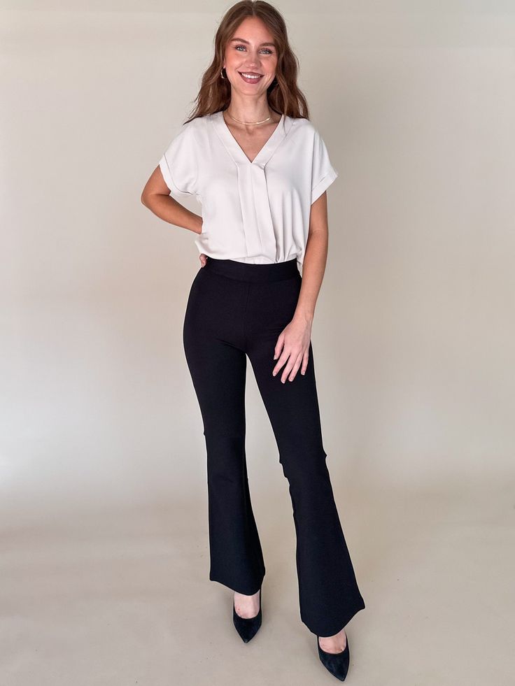 DESCRIPTION: We love a good flare pant and the Do It All Flare Pant has it all! This chic high rise pant features a slim fit throughout the hips, a kick flare, and our fave detail; the supportive feel from the durable, stretchy fabric. Fit and flare Mid Weight Ponte Flare leg detail Pull on Elastic Waist Unlined Mid-weight Ponte SIZE & FIT: Style is fitted, Model Is wearing size XS. MATERIAL & CARE: 62% Rayon, 33% Nylon, 5% Spandex | Wash Cold, Hang Dry Flare Black Pants Outfit Business Casual, Chic Stretch Mid-rise Flares, Business Casual Flared Bottoms, Casual Flare Work Pants, Casual Flare Workwear Pants, High Waist Stretch Flare Jeans For Work, Chic Fitted Flare Jeans For Work, Mid-rise Stretch Flares For Work, Chic Stretch Flares For Workwear