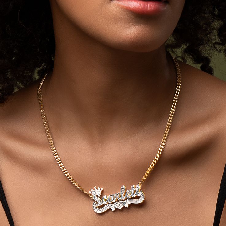 Our popular Double Plated Iced Princess Crown Name Necklace boasts a chic and elegant design, handcrafted to perfection. The model showcases the necklace with an 18-inch Cuban chain (see video for reference). You can personalize this item with Letters, Numbers, and Roman Numerals and choose from chain lengths of 14", 16", 18", and 20". Each chain features a lobster clasp closure for secure wear.Chain width:Cuban Chain - 3.7 mmFigaro Chain - 3 mmRope Chain - 2.3 mm XO Chain - 5 mm Elegant Personalized Cuban Link Chain Necklace, Personalized Cuban Link Necklace As Gift, Personalized Cuban Link Necklaces For Gift, Personalized Cuban Link Necklace For Gift, Luxury Personalized Cuban Link Jewelry, Elegant Cuban Link Chain Necklace As Gift, Elegant Cuban Link Chain Necklace Gift, Fine Jewelry Cuban Link Necklace, Fine Jewelry Cuban Link Necklace For Gift