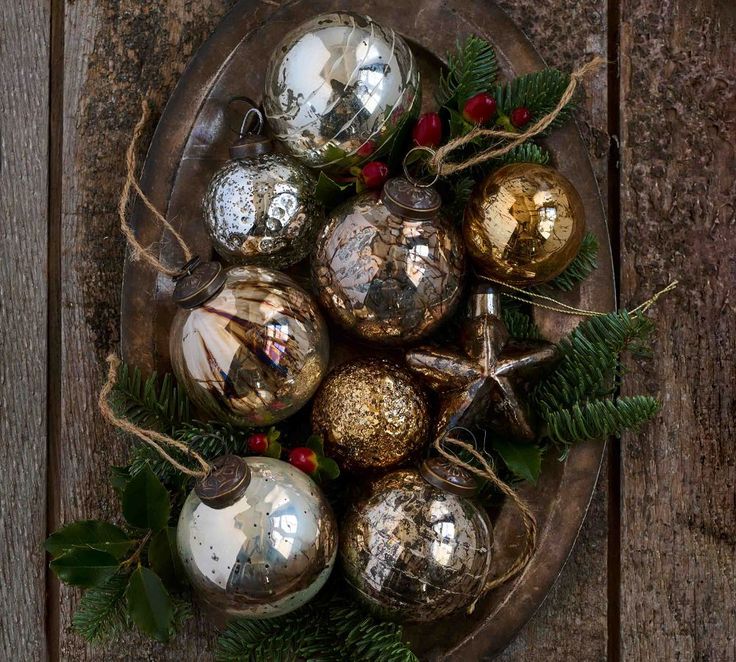 christmas ornaments are arranged on a platter