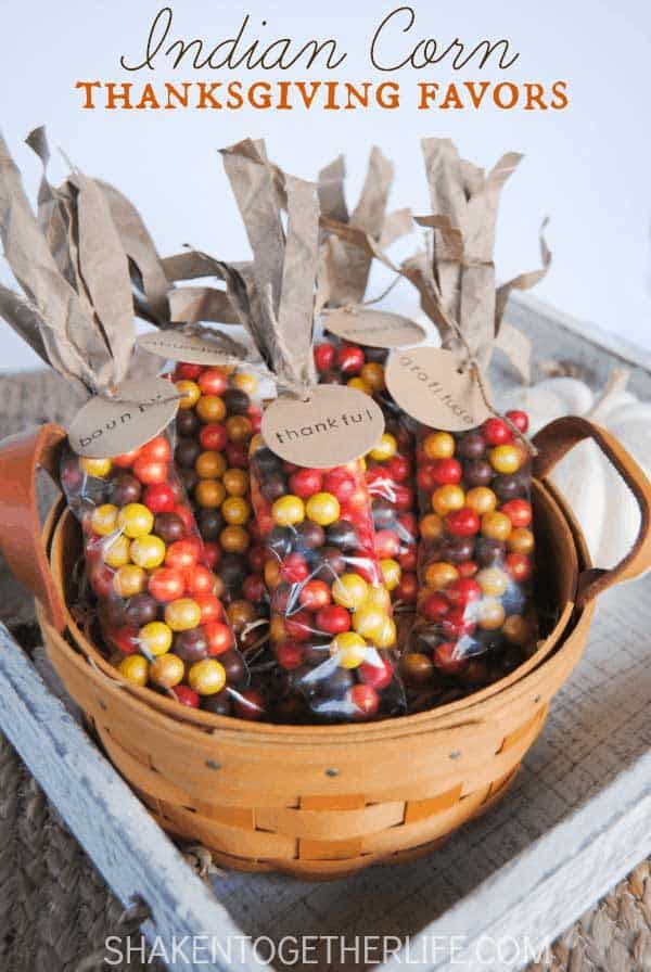 a basket filled with candy corn on top of a table