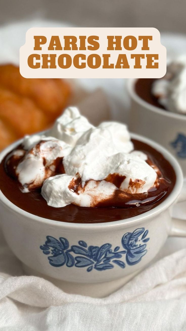 two bowls filled with hot chocolate and marshmallows