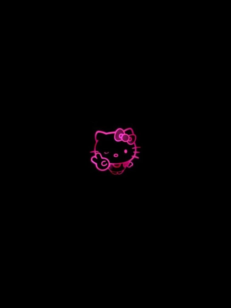 a pink hello kitty wallpaper in the dark