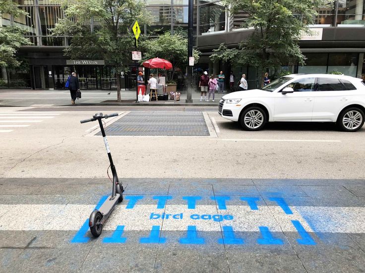 an electric scooter is parked on the street