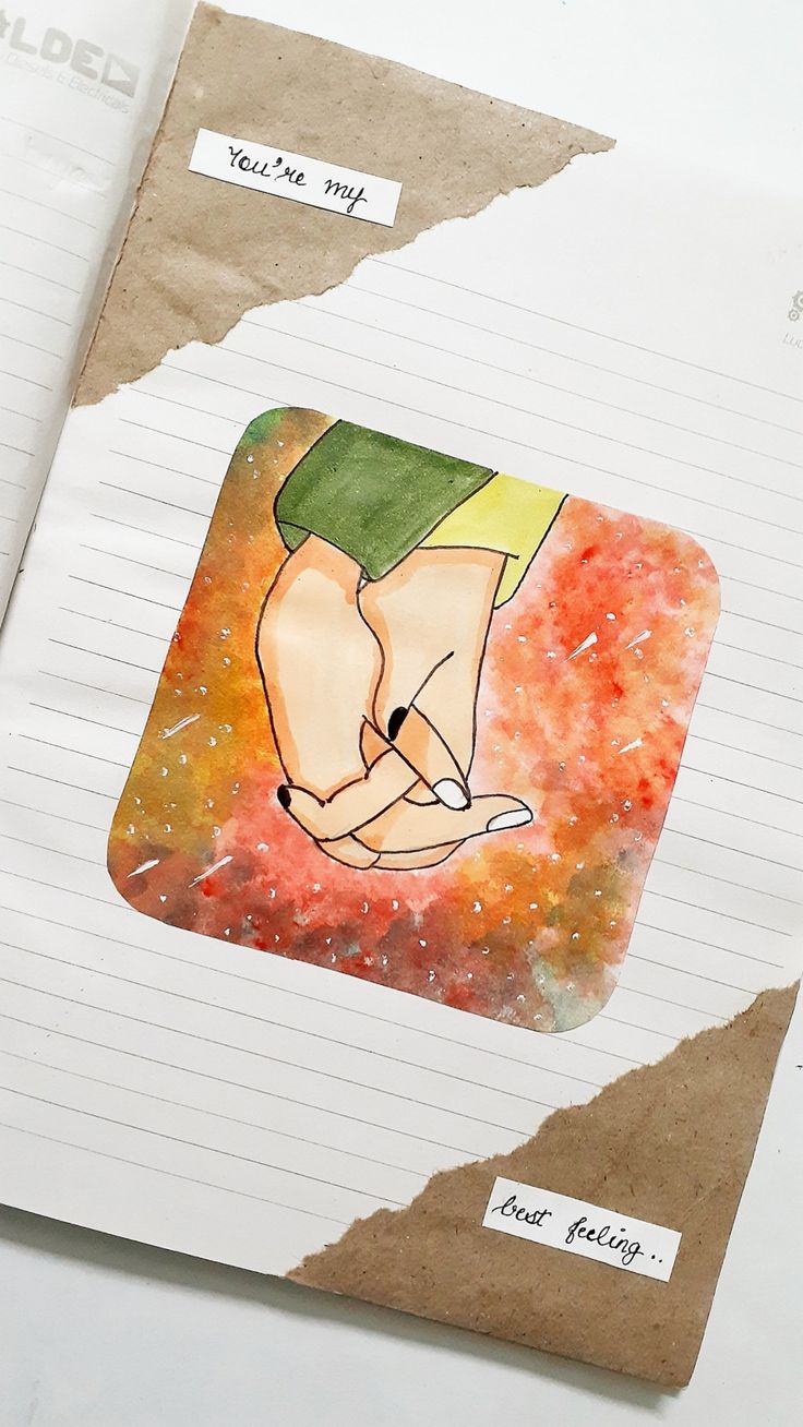 a piece of paper with a drawing of a hand holding a baby's head