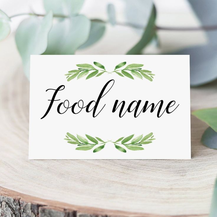 a card with the word food name on it next to some leaves and branches in front of a white background