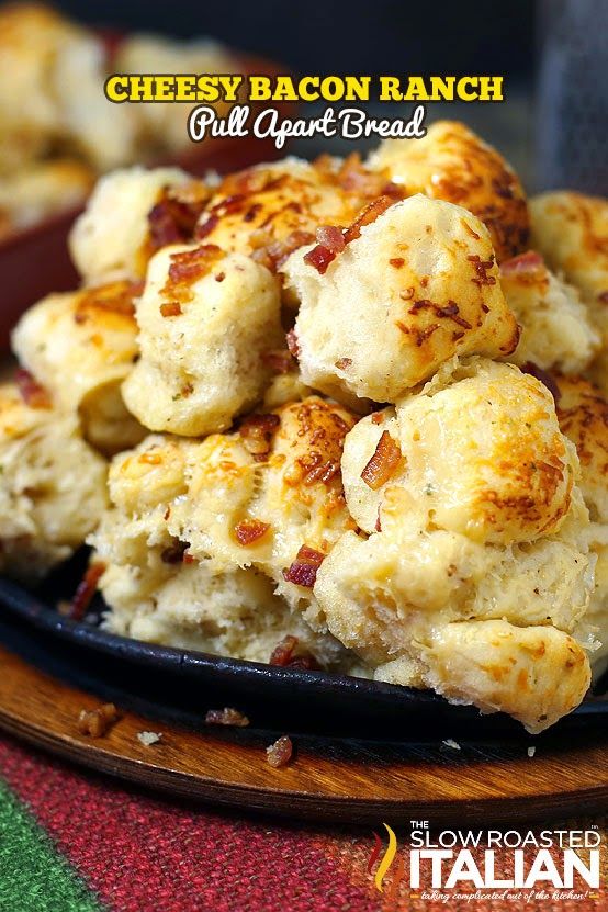 cheesy bacon ranch grill apart bread on a black plate with red and green table cloth