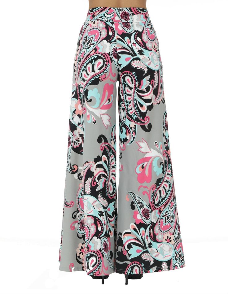 Mid-waist pull-on Palazzo Pants with floral design. The model is wearing a size small. Material: 80% Nylon 20% Spandex Chic Wide-leg Pants With Floral Print, Chic Wide-leg Floral Print Pants, Chic Floral Print Wide-leg Pants, Patterned Printed Bottoms For Spring, Chic Patterned Printed Pants, Chic Printed Patterned Pants, Trendy Straight Pants With Floral Print, Trendy High-waisted Wide Leg Pants With Floral Print, Trendy Floral Print Straight Pants