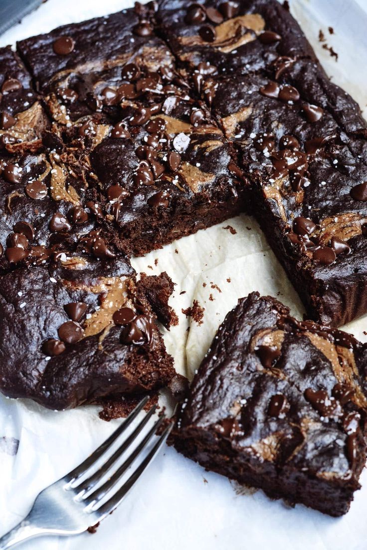 a close up of a cake on a plate with a fork