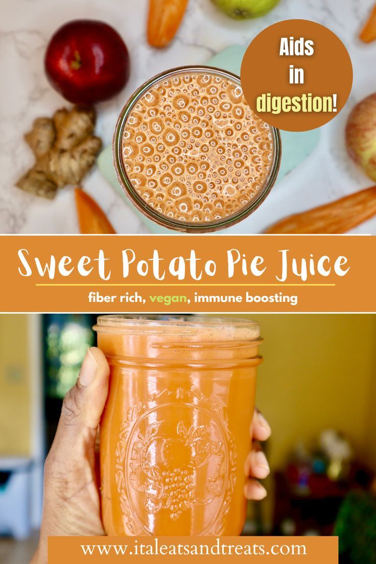 a person holding up a mason jar filled with sweet potato juice and apples in the background