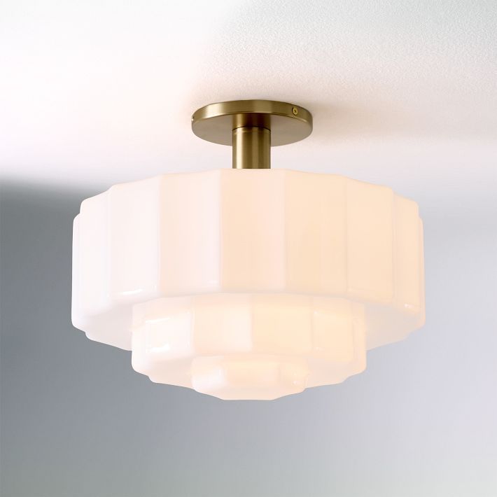 a close up of a light fixture in a room with white walls and flooring