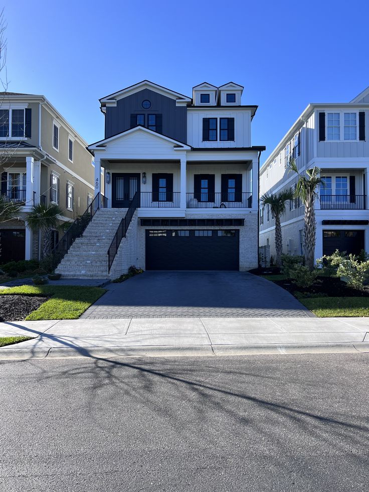 two story house with white trim and black shutters