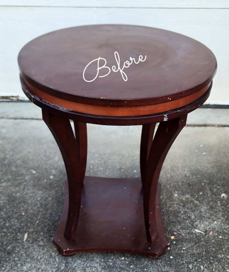 a small wooden table with the word believe written on it's top and bottom