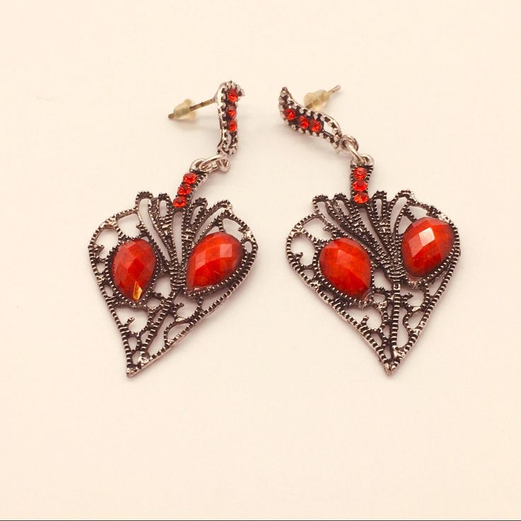 Long Red Earrings Elegant Red Single Clip-on Earring, Red Metal Drop Earrings, Red Heart-shaped Metal Earrings, Elegant Red Metal Heart Earrings, Elegant Red Heart Metal Earrings, Elegant Red Earrings For Valentine's Day, Red Metal Earrings For Party, Vintage Red Heart Earrings For Pierced Ears, Red Vintage Heart Earrings