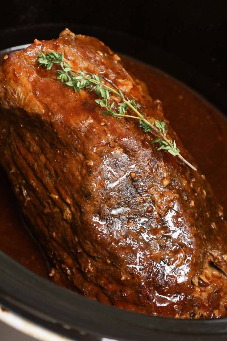 a close up of a cooked meat in a slow cooker