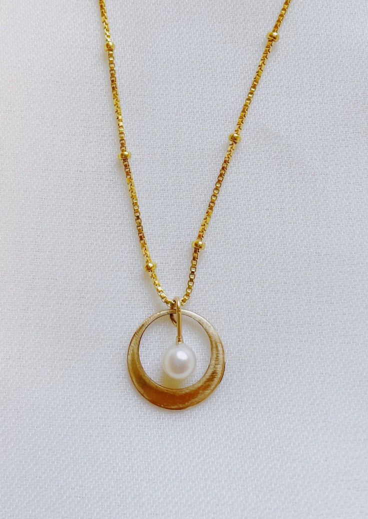 Classic and timeless in design and nature - the Whirl Necklace is a special piece made to make new memories in. 14 K gold-filled White Freshwater Pearl 14k Gold-filled Round Pearl Pendant Jewelry, Gold 14k Everyday Pearl Necklace, Everyday Gold Pearl Necklace In 14k Gold, Everyday 14k Gold Pearl Necklace In Gold, Nickel Free Yellow Gold Necklace For Everyday, Yellow Gold Brass Jewelry With Pearl Charm, Everyday Nickel-free Yellow Gold Necklace, Everyday Yellow Gold Charm Necklace With Pearl Pendant, Elegant 14k Gold Filled Nickel-free Necklaces