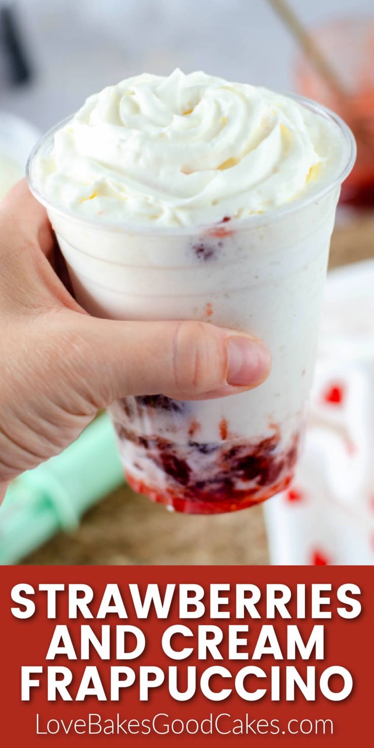 strawberry cheesecake and cream frappuccino in a plastic cup with whipped cream on top