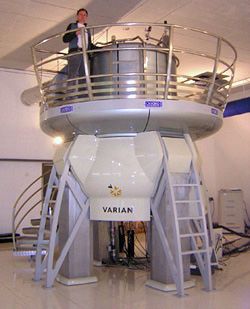 a man standing on top of a large white object