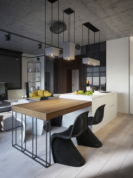 an open concept kitchen and dining area with modern furniture