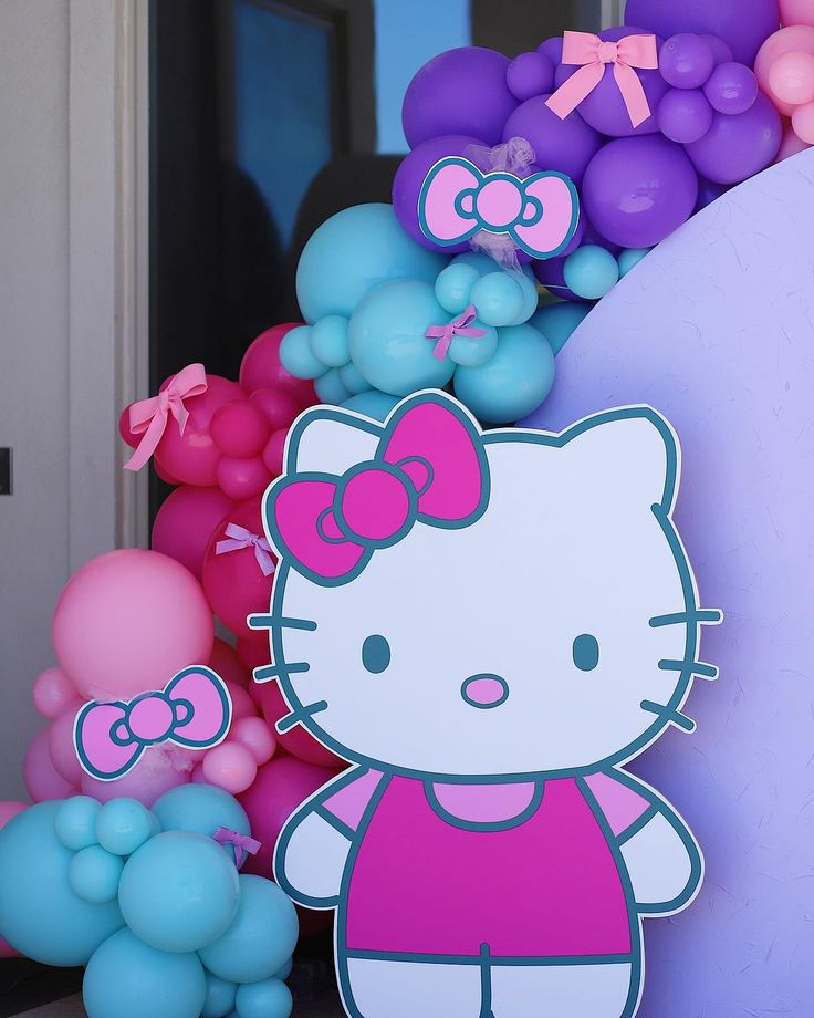 the hello kitty balloon arch is decorated with balloons