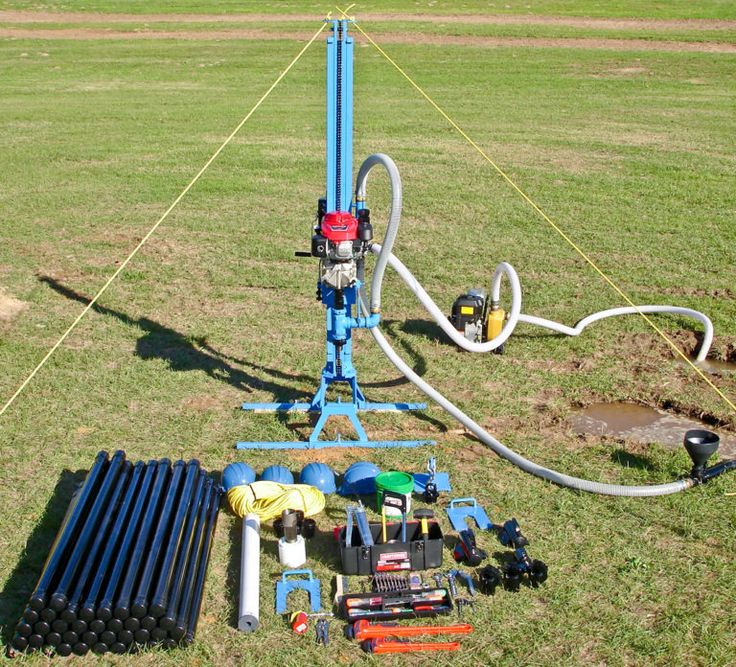 the equipment is laying out on the grass in front of the water pump and hoses