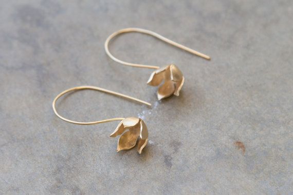 Drop  gold blooming flower earrings. Designer delicate dangle earring. holiday gift. Romantic gift f Dainty Flower Earrings With Ear Wire For Wedding, Delicate Dangle Flower Earrings With Matching Set, Delicate Drop Flower Earrings For Bridesmaid Gift, Gold Earrings With Flower Charm In Delicate Style, Delicate Teardrop Flower Earrings For Anniversary, Elegant Brass Flower Earrings For Wedding, Delicate Dangle Flower Earrings For Bridesmaids, Dainty Flower Bridal Earrings, Elegant Brass Earrings With Flower Charm