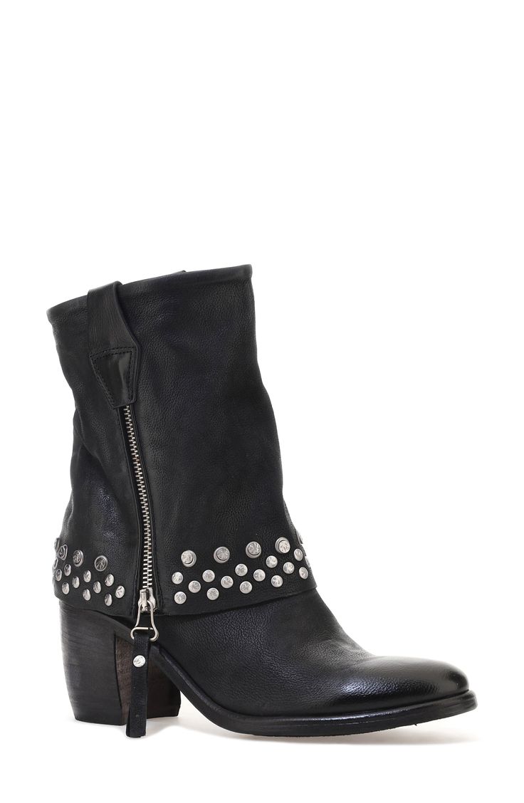 Double-down on contemporary Western styling in this leather boot designed with a dual zip closures and a fold-over-look shaft dotted with studs around the arch-grazing cuff. 3 1/2" heel; 1/2" platform 7 1/4" shaft Dual side-zip closures Leather upper and lining/synthetic sole Imported Rugged Moto Boots With Rivets For Fall, Leather Punk Moto Boots With Zipper Closure, Edgy Leather Moto Boots With Zipper Closure, Edgy Leather Moto Boots With Zipper, Winter Leather Boots With Silver Studs, Punk Leather Moto Boots With Silver Studs, Fall Rivet Boots For Biker Events, Punk Leather Boots With Silver Studs, Edgy Winter Boots With Silver Studs