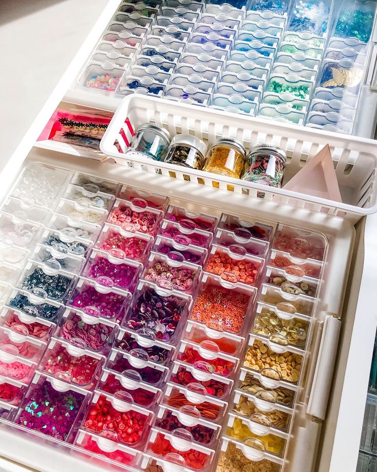 a drawer filled with lots of different colored beads