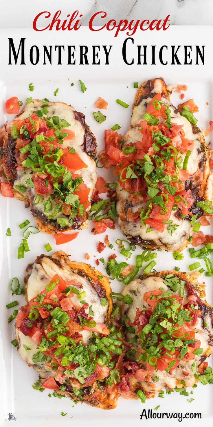 four grilled chicken topped with tomatoes and cilantro on a white platter