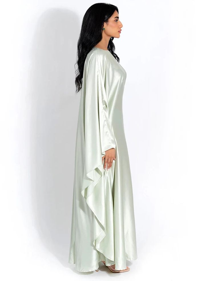 Embrace elegance in our new satin cloak, featuring long sleeves and a loose fit for comfort and style. With an O-neck design, this long dress exudes sophistication, perfect for ladies who seek a fashionable yet relaxed ensemble for any occasion. Details: Fit Type: Slim Neckline: O-Neck Material: Silk Material: SPANDEX Closure Type: Pullover Waistline: Natural Silk Material, Cloak, Neck Designs, Long Dress, Loose Fitting, Long Sleeves, Satin, Long Sleeve