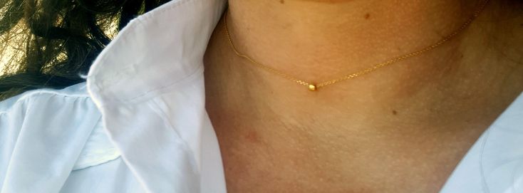 "A dainty minimal 14k gold necklace that has a tiny gold bead that slides on the chain. This simple yet timeless necklace will make a perfect gift for your best friend, your sister, mother or bridesmaids. All components and findings are two micron vermeil gold which means 925 sterling silver with two layers of 14K gold. A Vermeil piece of jewelry is made entirely of precious metals (NO BRASS), which gives the piece an intrinsic value. Materials: - 14K gold shiny, delicate chain - 14K gold ball - Minimalist Tiny Charm Necklaces For Everyday, Minimalist Everyday Charm Necklace With Simple Design, Dainty Everyday Necklace With Tiny Beads, Everyday Minimalist Charm Necklace With Simple Design, Simple 14k Gold Charm Necklace For Everyday, Minimalist Everyday Charm Necklace, Minimalist Tiny Necklace For Everyday, Minimalist Tiny Necklaces For Everyday, Tiny Gold Minimalist Necklace