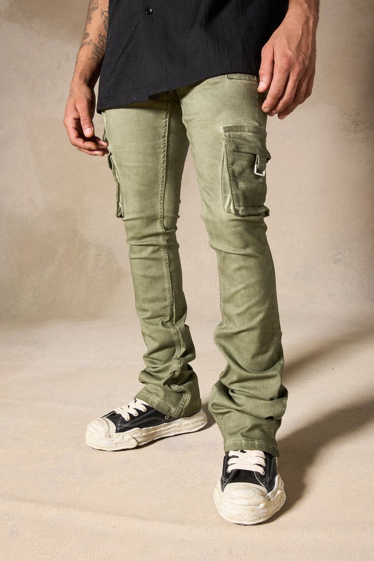 SERENEDE® "OIL" cargo stacked jeans feature our signature stretch material for a comfortable feel. Olive wash* with a slight tint of green. SERENEDE® signature skinny fit construction with a stacked ankle. This unique style features multiple cargo pockets. Designed to be individually unique. DETAILED FEATURES: OLIVE wash [ slight tint of green ] Cargo pockets Stacked finish Fading throughout Signature "leather" waistband label SERENEDE® branded hardware Five-pocket styling Zipper fly 5.5" W Ankl Olive Utility Cargo Jeans, Fitted Urban Cargo Jeans With Cargo Pockets, Military Cargo Style Jeans For Streetwear, Military Style Jeans With Side Pockets For Streetwear, Fitted Urban Cargo Jeans, Fitted Khaki Cargo Pants For Streetwear, Fitted Cargo Jeans With Multiple Pockets For Streetwear, Military Style Olive Cargo Pants For Streetwear, Olive Military Cargo Pants For Streetwear