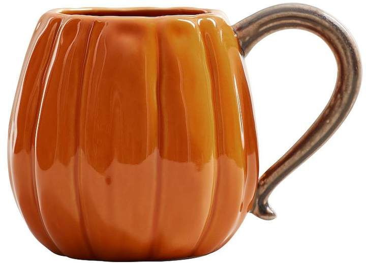 an orange ceramic mug with a metal handle