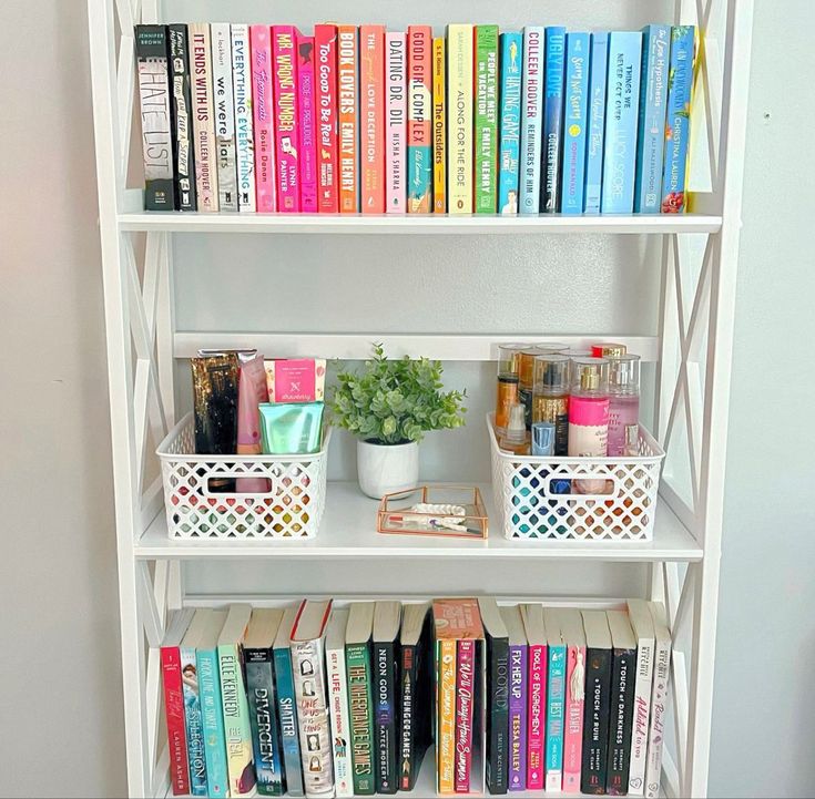 a white book shelf filled with lots of books