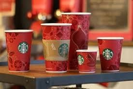 starbucks cups are lined up on a table