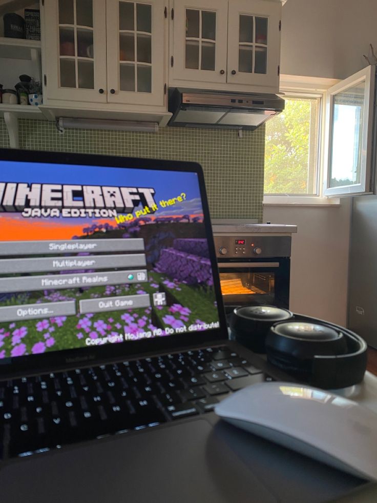 a laptop computer sitting on top of a desk