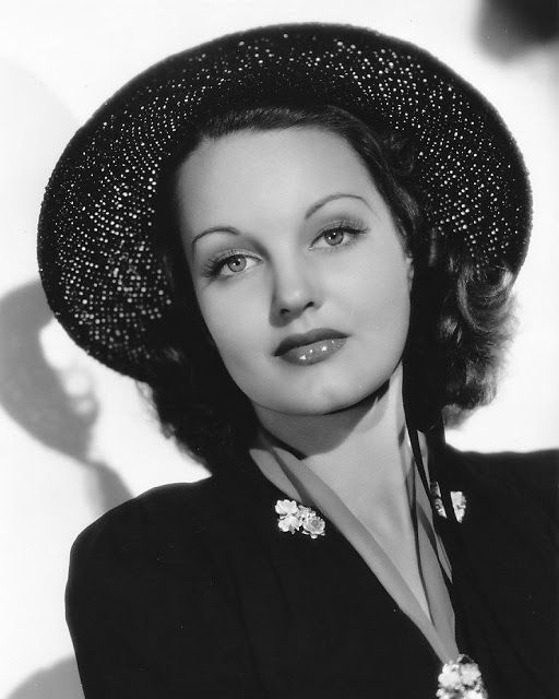 black and white photograph of a woman wearing a hat