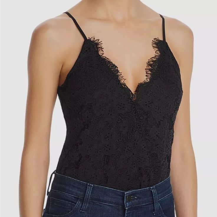 Beautiful Black Lace Details! Crossover V-Neck With Snap Closure Adjustable Spaghetti Straps Cheeky Coverage, Snap Gusset Lace Design, Lined Bodice Self: 55% Cotton/45% Nylon; Contrast: 100% Polyester; Lining: 96% Polyester/4% Spandex Elegant Camisole Bodysuit For Night Out, Elegant Cami Bodysuit For Party, Chic Party Bodysuit With Camisole Design, Chic Spaghetti Strap Tops With Lined Body, Chic Tops With Spaghetti Straps And Lined Body, Spring V-neck Top With Lined Body, Spring Party Camisole With Lined Body, Elegant Lined Camisole For Spring, Night Out Top With Spaghetti Straps And Lined Body