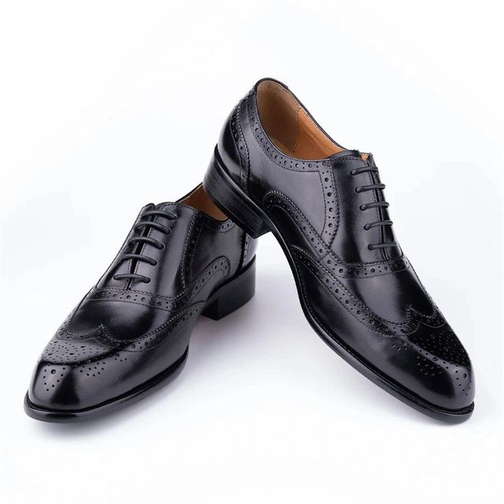 Step into sophistication with our elegant carved British leather Wedding shoes. Crafted from the finest first layer cowskin, these shoes feature a solid pattern and a round toe shape for a timeless and polished look. With a genuine leather lining and a rubber outsole for added comfort and durability, these lace-up shoes are perfect for any business occasion. Elevate your style and make a lasting impression with our exquisite leather business shoes. Elegant Lace-up Cap Toe Shoes For Galas, Elegant Cap Toe Lace-up Shoes For Galas, Wingtip Oxford Wedding Oxfords, Wingtip Oxford Shoes For Wedding, Oxford Dress Shoes With Brogue Detailing For Wedding, Wingtip Oxford Oxfords For Weddings, Black Closed Toe Oxfords For Wedding, Classic Closed Toe Lace-up Wedding Shoes, Black Wingtip Dress Shoes For Wedding