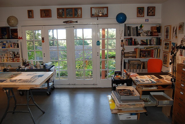 the room is full of books, magazines and other things on display in it's windows