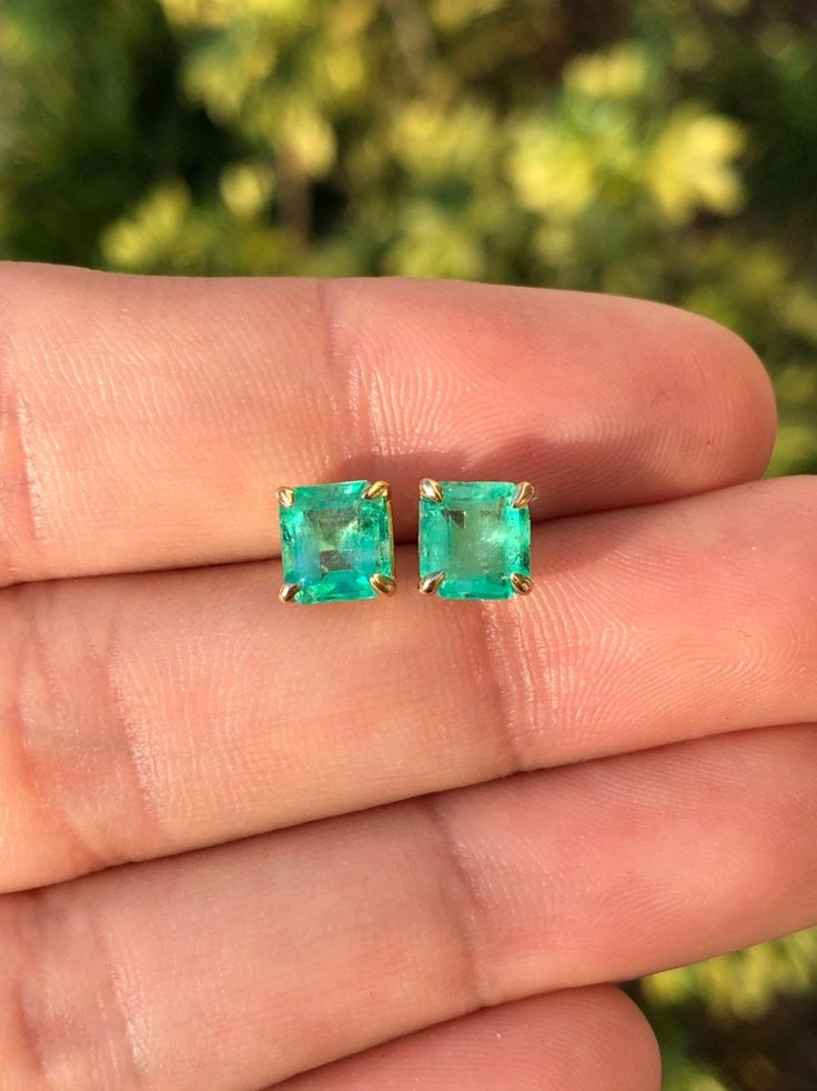 Featured here is a beautiful set of emerald cut Colombian emerald studs in fine 14K yellow gold. Displayed are medium-green emeralds with very good transparency, accented by a simple four-prong 14K gold mount, allowing for the emerald to be shown in full view. The earth mined, green Colombian emeralds have a desirable lush green color with excellent qualities. These earrings are ideal for everyday use and are the perfect accessory to any outfit. Total Carat Weight: 2.0cts Setting Style: Four Pro Green Baguette Cut Earrings For Gifts, Baguette Cut Emerald Earrings As A Gift, Emerald Cut Green Gemstone Earrings, Emerald Cut Green Earrings, Fine Jewelry Emerald Cut May Birthstone Earrings, Fine Jewelry Emerald Cut Earrings For May Birthstone, May Birthstone Emerald Cut Fine Jewelry Earrings, Fine Jewelry Baguette Cut Emerald Earrings, Fine Jewelry In Green Color