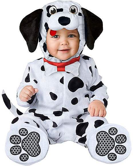 a baby dressed in a dalmatian costume