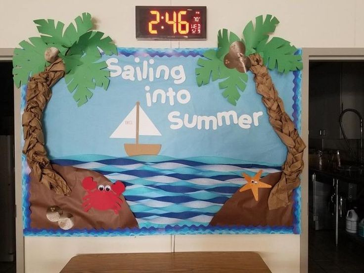 a bulletin board that says sailing into summer with palm trees and crab on the beach