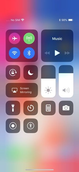 an iphone screen with various icons and buttons in the bottom right corner, including music